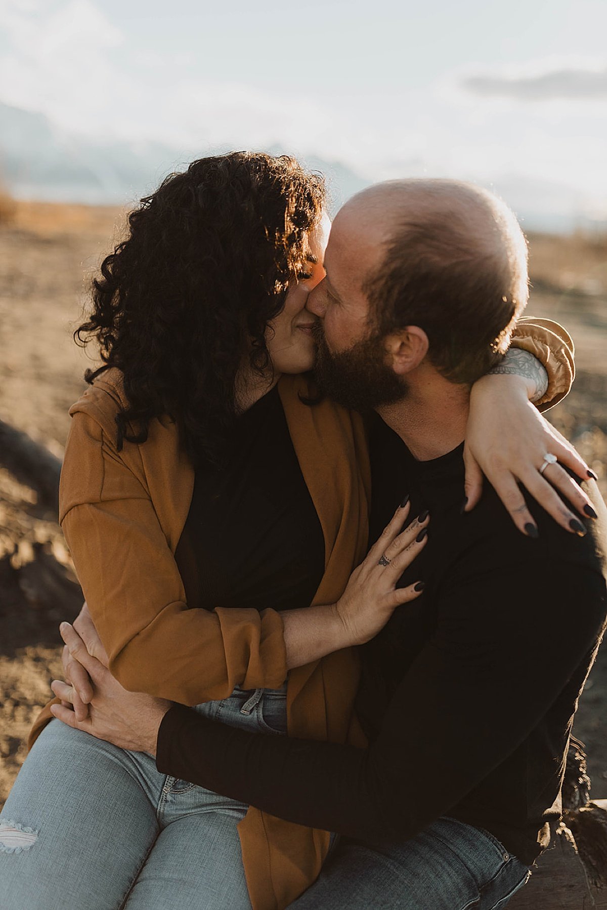  Newly engaged couple kiss in golden hour shoot by Theresa McDonald Photography 