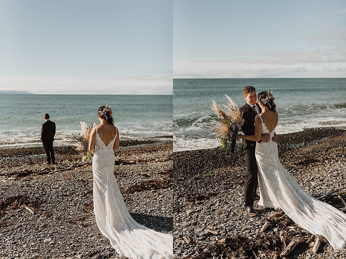  bride and groom share first look on alaska beach before snowy fall wedding 
