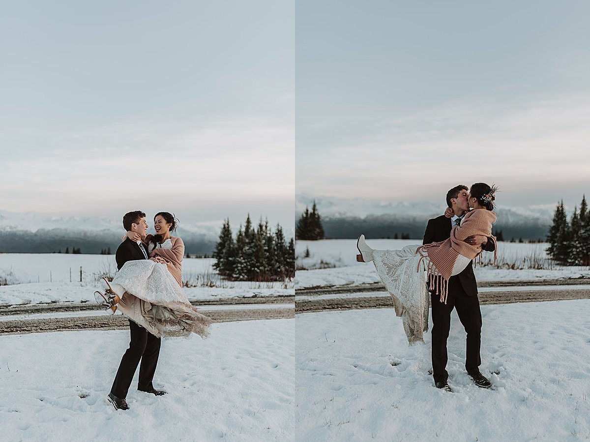  groom sweeps bride off her feet at twilight after snowy fall wedding in alaska 