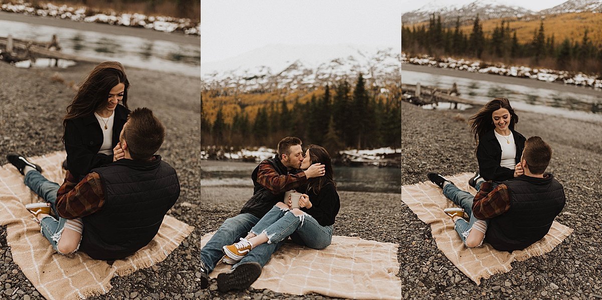  newly engaged couple lounge on blanket with mugs of coffee during alaska mountain lake shoot with theresa mcdonald 