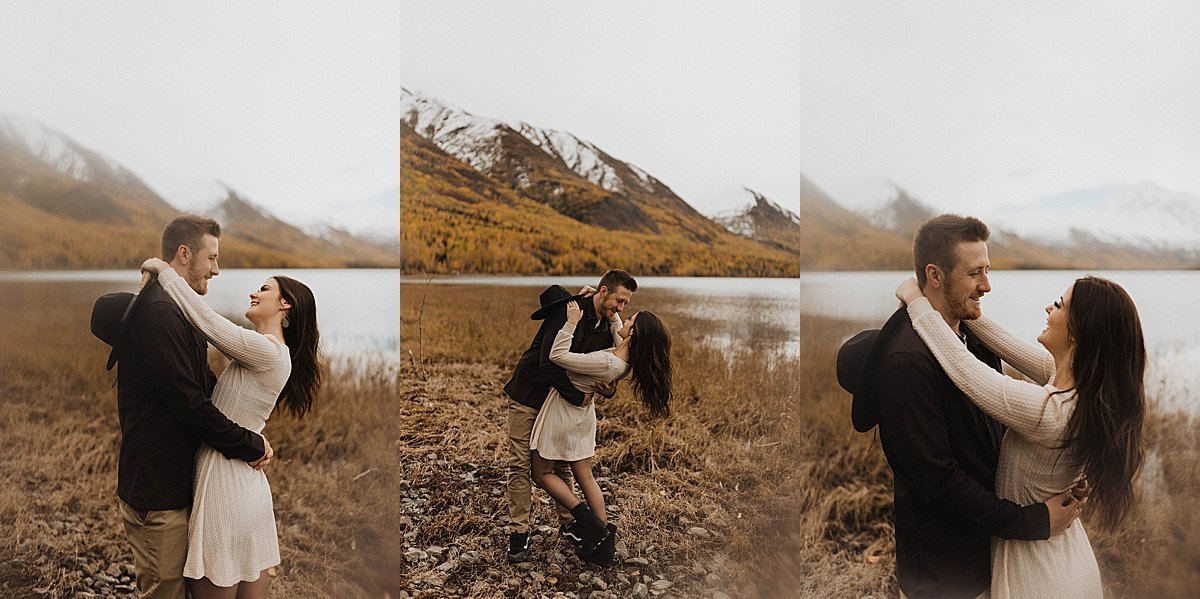  engaged couple pose in front of mountain lake during shoot by theresa mcdonald photography 