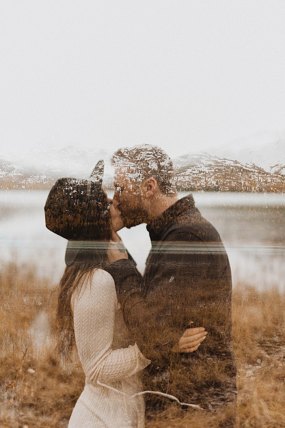  engaged couple kiss with image of mountains superimposed on top for artsy alaska shoot by theresa mcdonald 