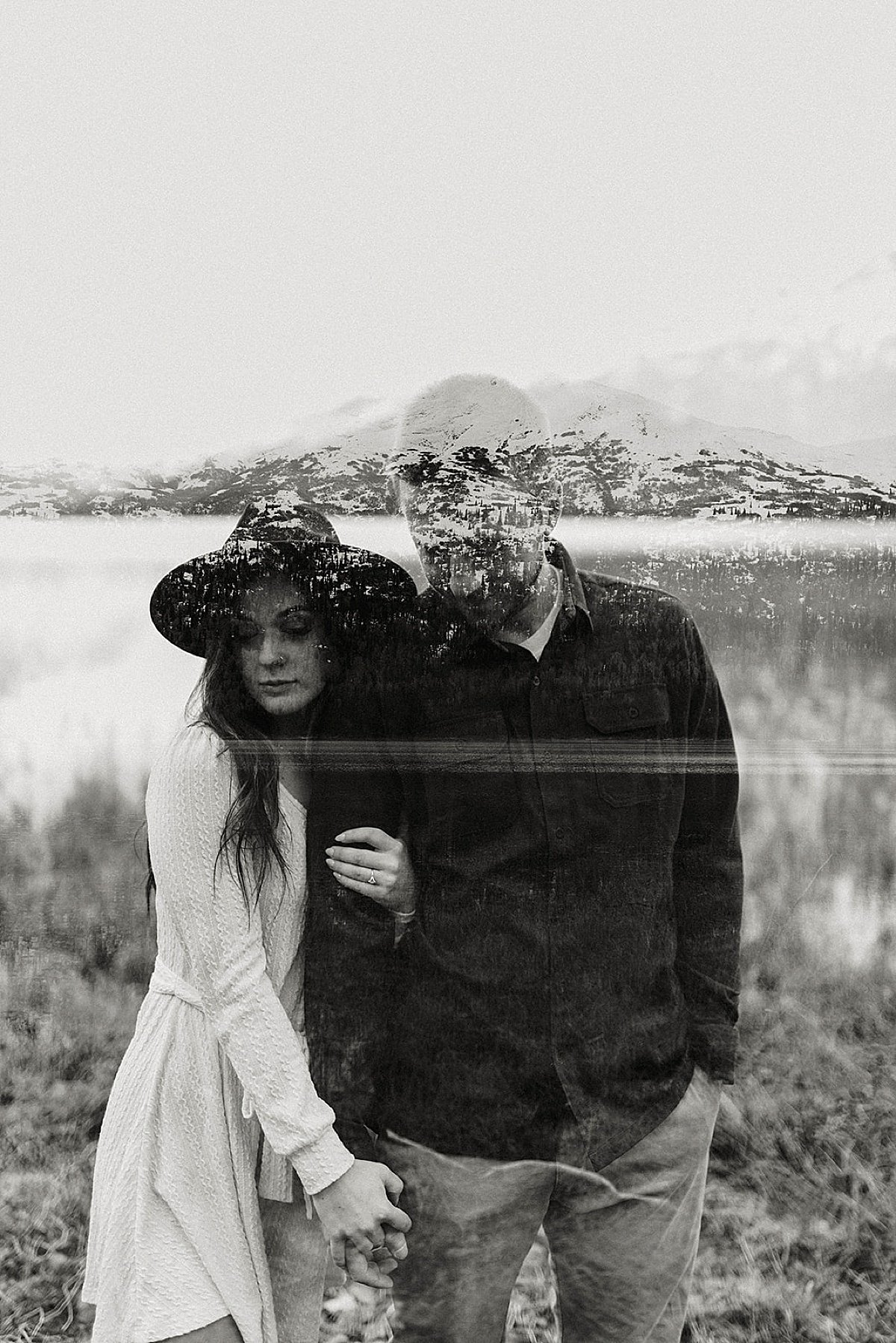  mountain vista superimposed over engaged couple posing for artsy shoot by alaska wedding photographer 