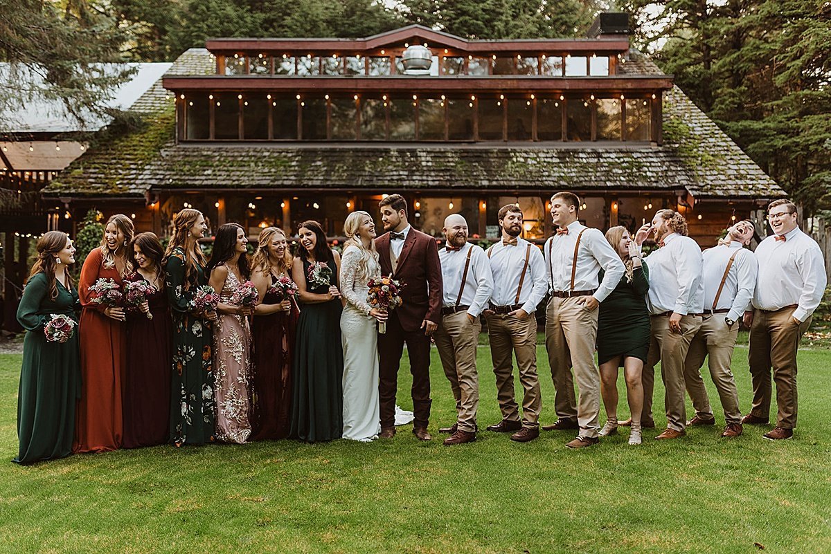  full wedding party stands with bride and groom after ceremony shot in girdwood, alaska by theresa mcdonald 