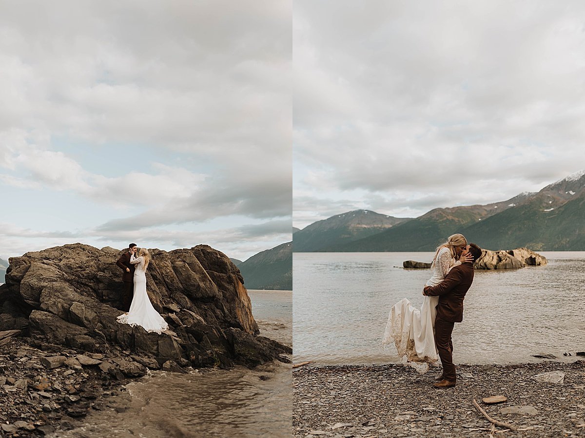  newlywed bride and groom kiss on rocky beach at dramatic mountain lake in alaska shot by theresa mcdonald photography 
