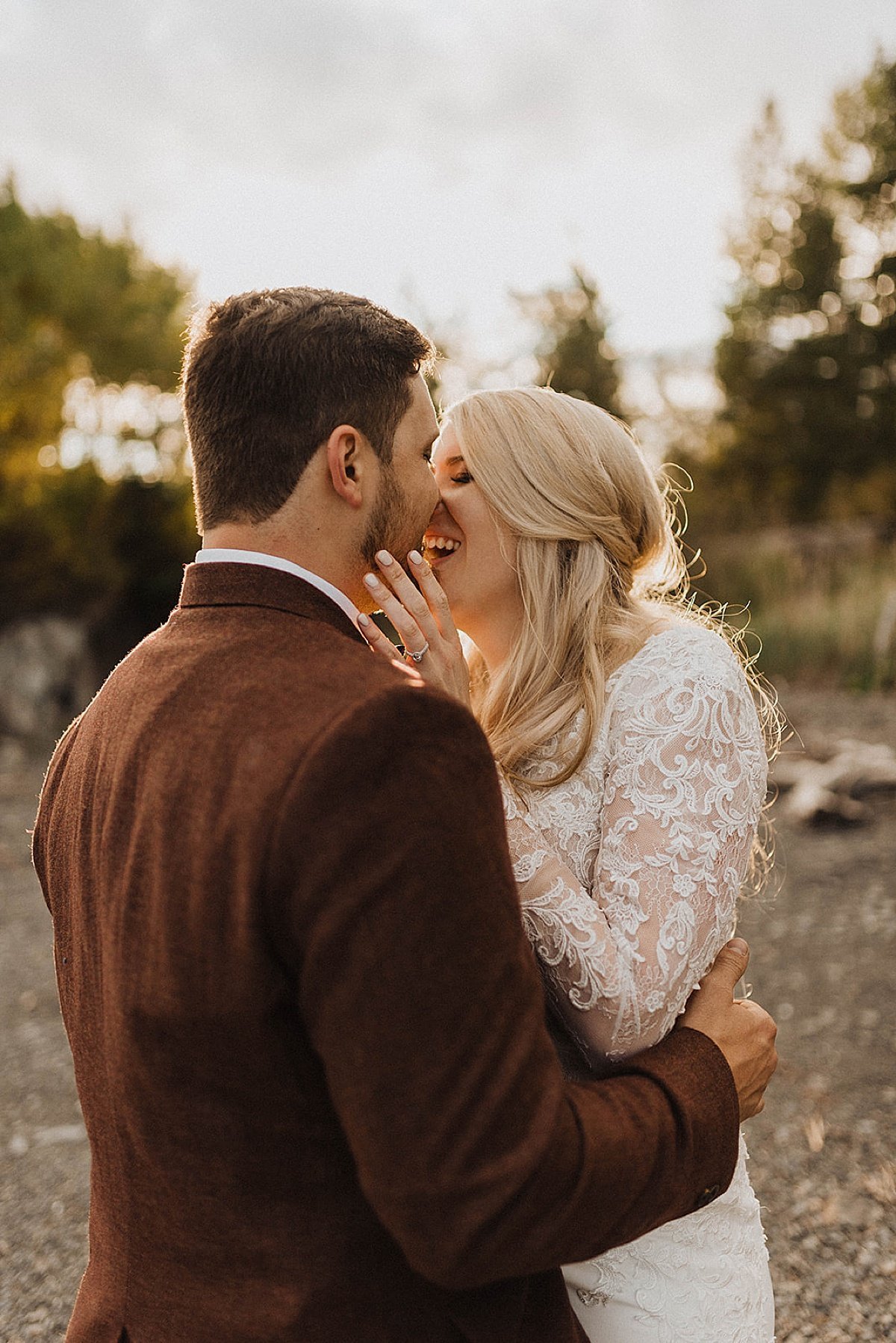  newlywed bride and groom share a kiss during golden hour at outdoor girdwood, ak wedding shot by theresa mcdonald photography 