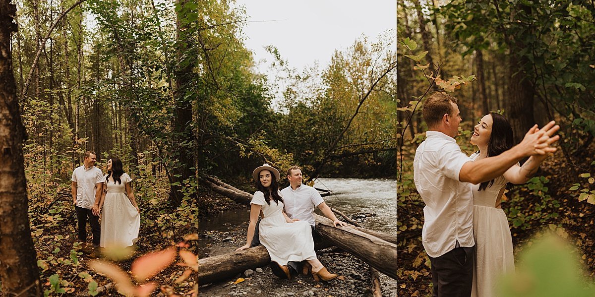  Man and woman in white dress dance with each other in the outdoors during woodsy engagement shoot 