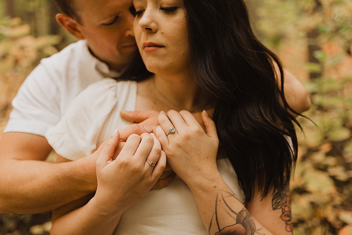  Couple shows off diamond ring in woodsy engagement shoot  
