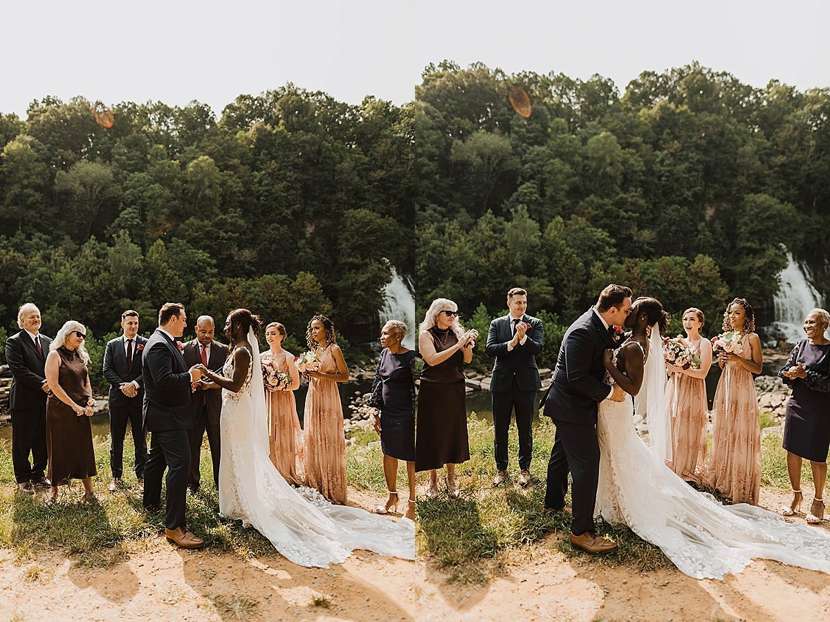  Bride and groom kiss at ceremony for Tennessee wedding by natural waterfall  