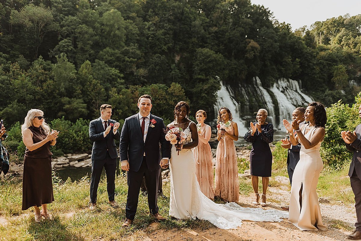  Bridal party celebrates the couple after ceremony at outdoor wedding shoot 