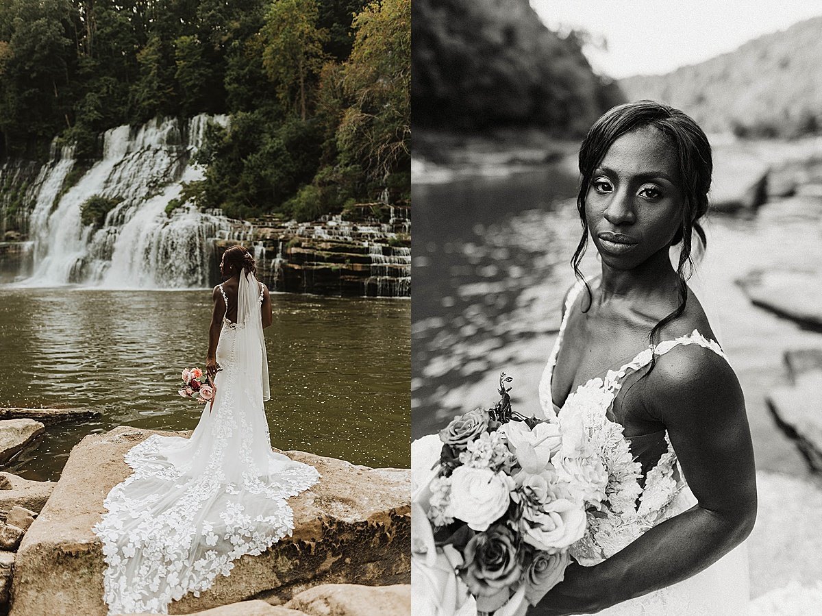  Bride in white dress with long train poses in front of waterfall at Tennessee wedding 