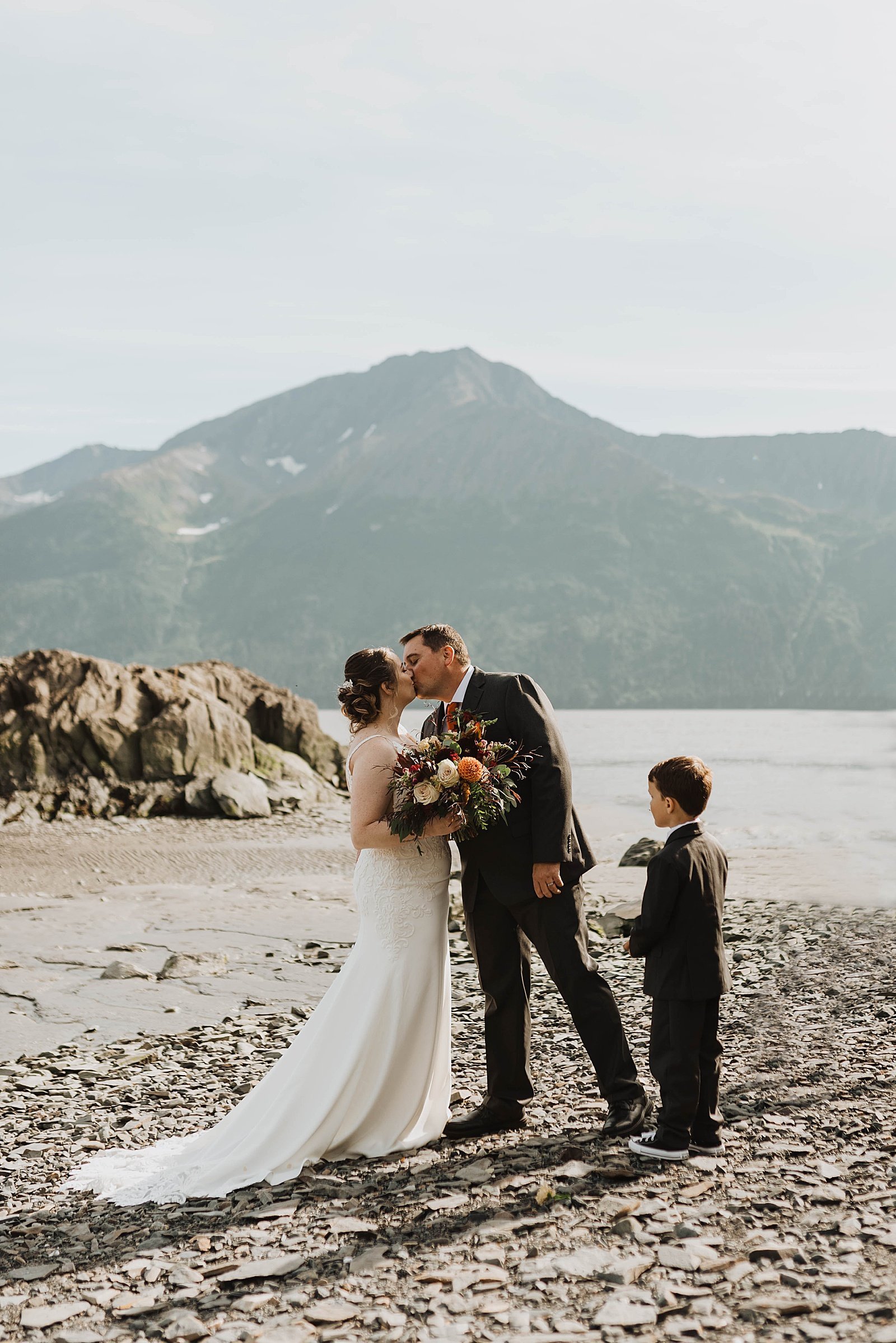  Bride and groom share a kiss at their Girdwood intimate family elopement 
