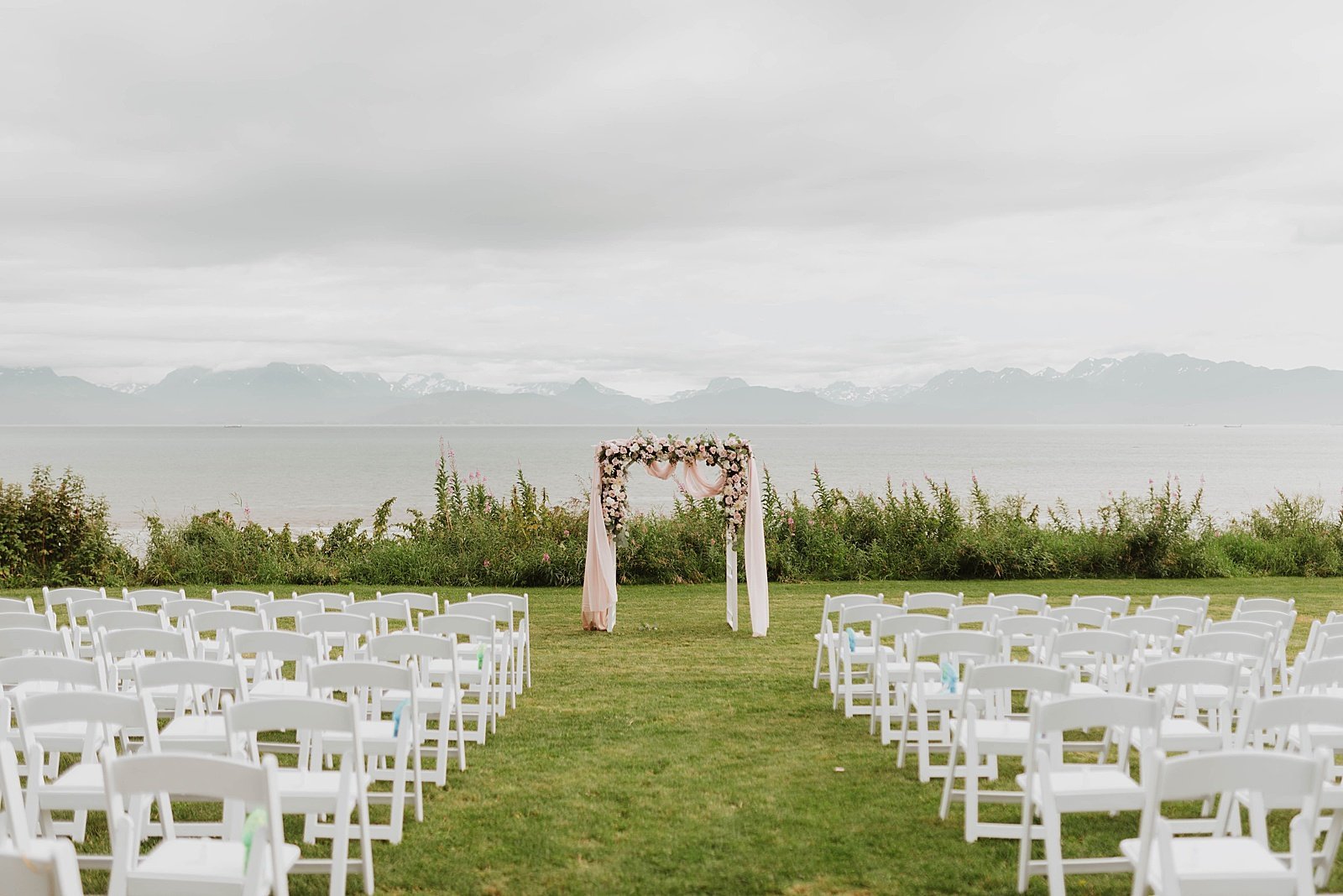  Ceremony set up on a lawn in front of the water  in Homer, Alaska 