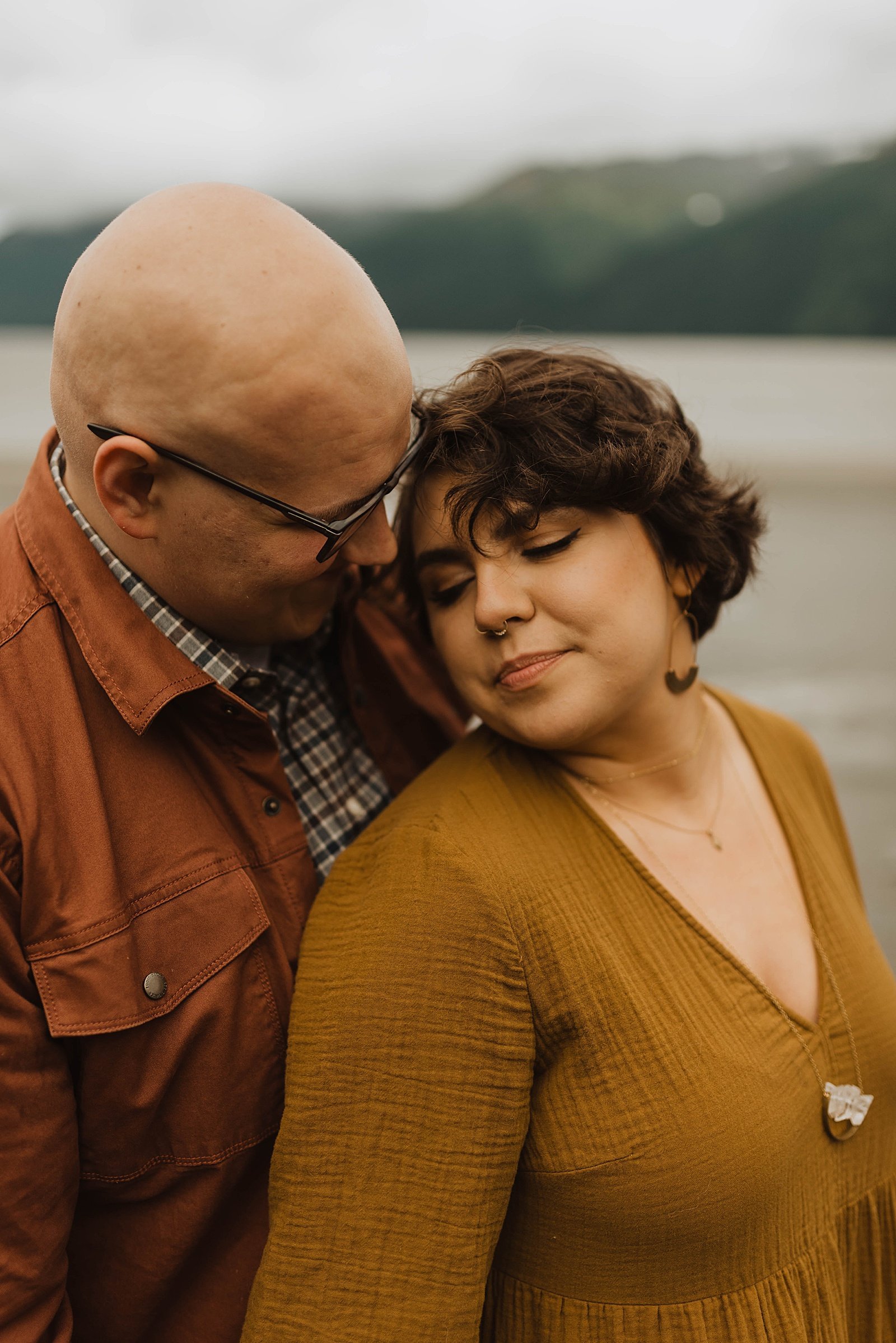  Woman leaning close to her husband for photo shoot with Alaska wedding photographer, Theresa McDonald. 