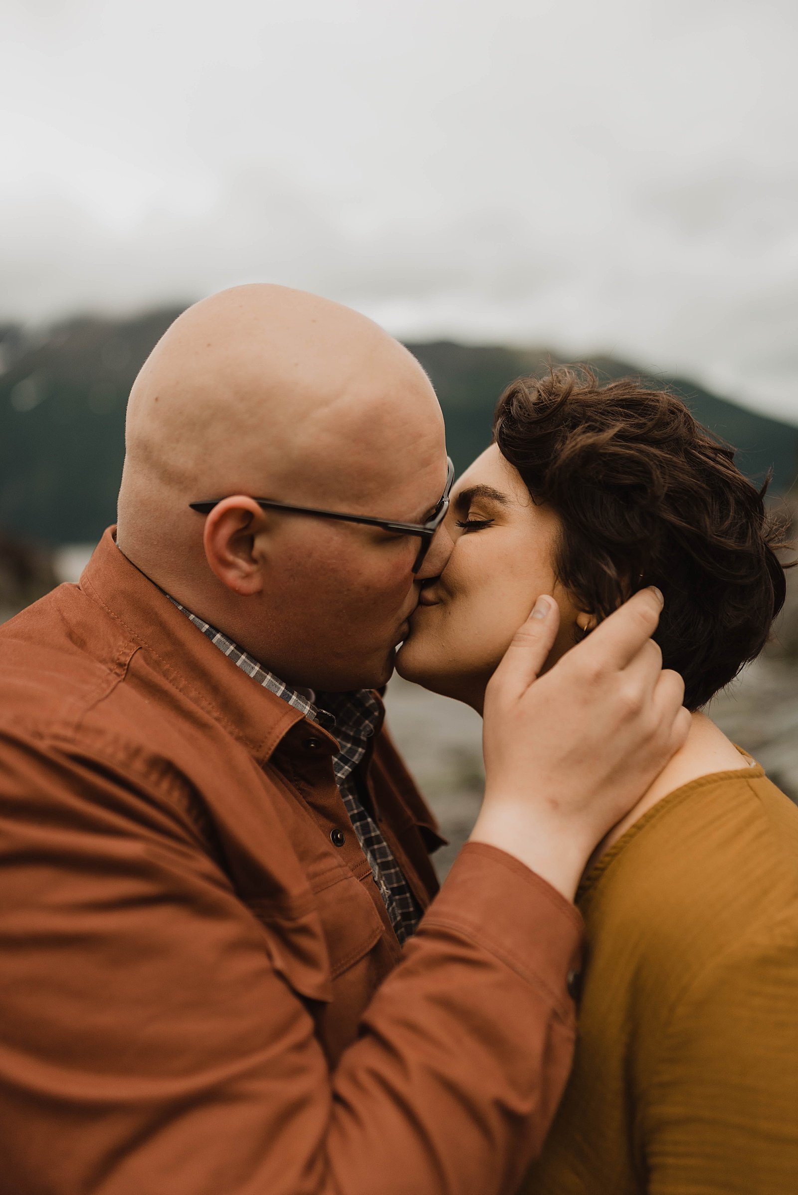  Husband and wife kissing at their photo session with Alaska wedding photographer, Theresa McDonald. 