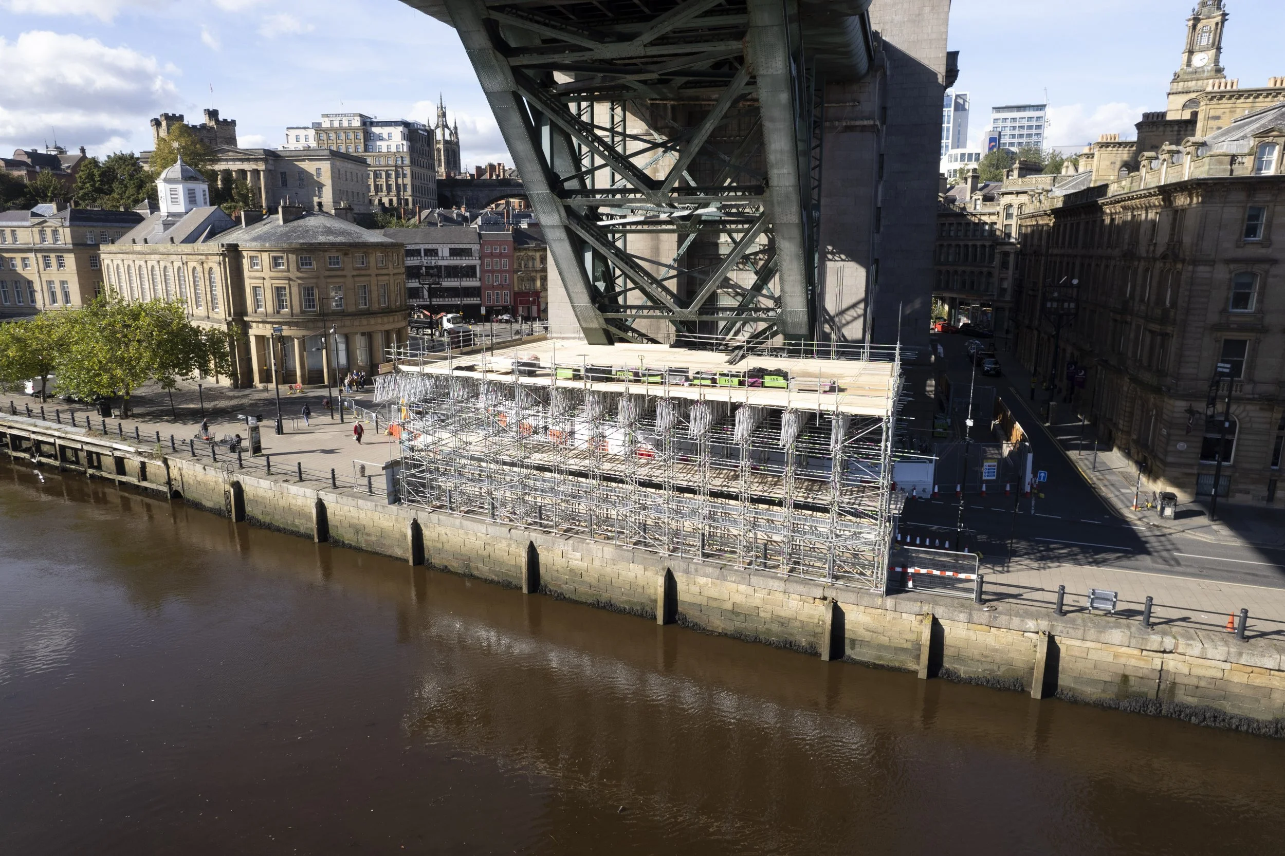 And so it begins on the Newcastle quayside. Here you can see the first section of scaffolding built up to ‘protection deck level’. Another eight levels of scaffolding are then built on top of this.