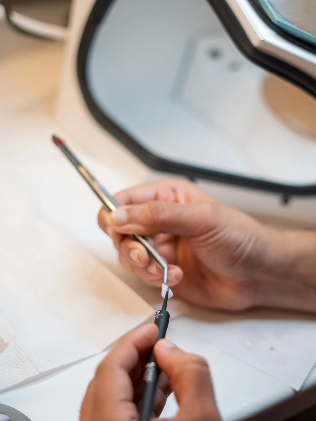 Dr Mustafa Bassam preparing veneers with paint