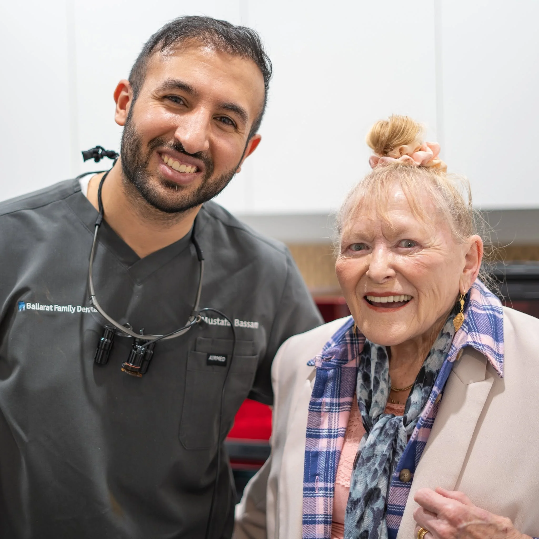 Dr Mustafa Bassam with a smiling happy patient
