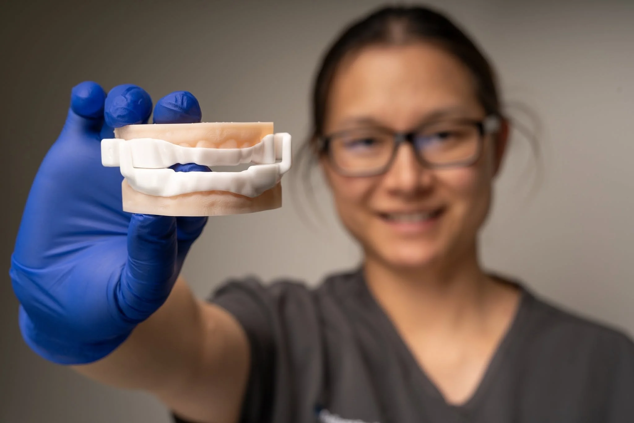 Dr Becky Chen holding sleep apnea device