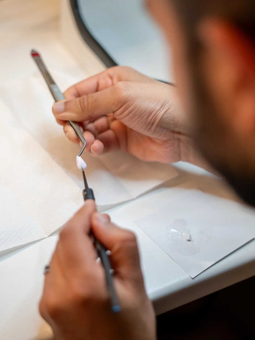 Dr Mustafa Bassam characterizing veneers with paint