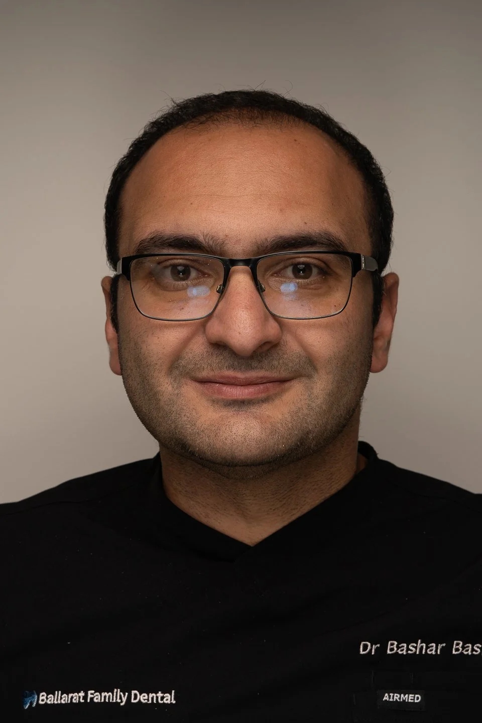 Dr Bashar Basmaji portrait photo with a black shirt