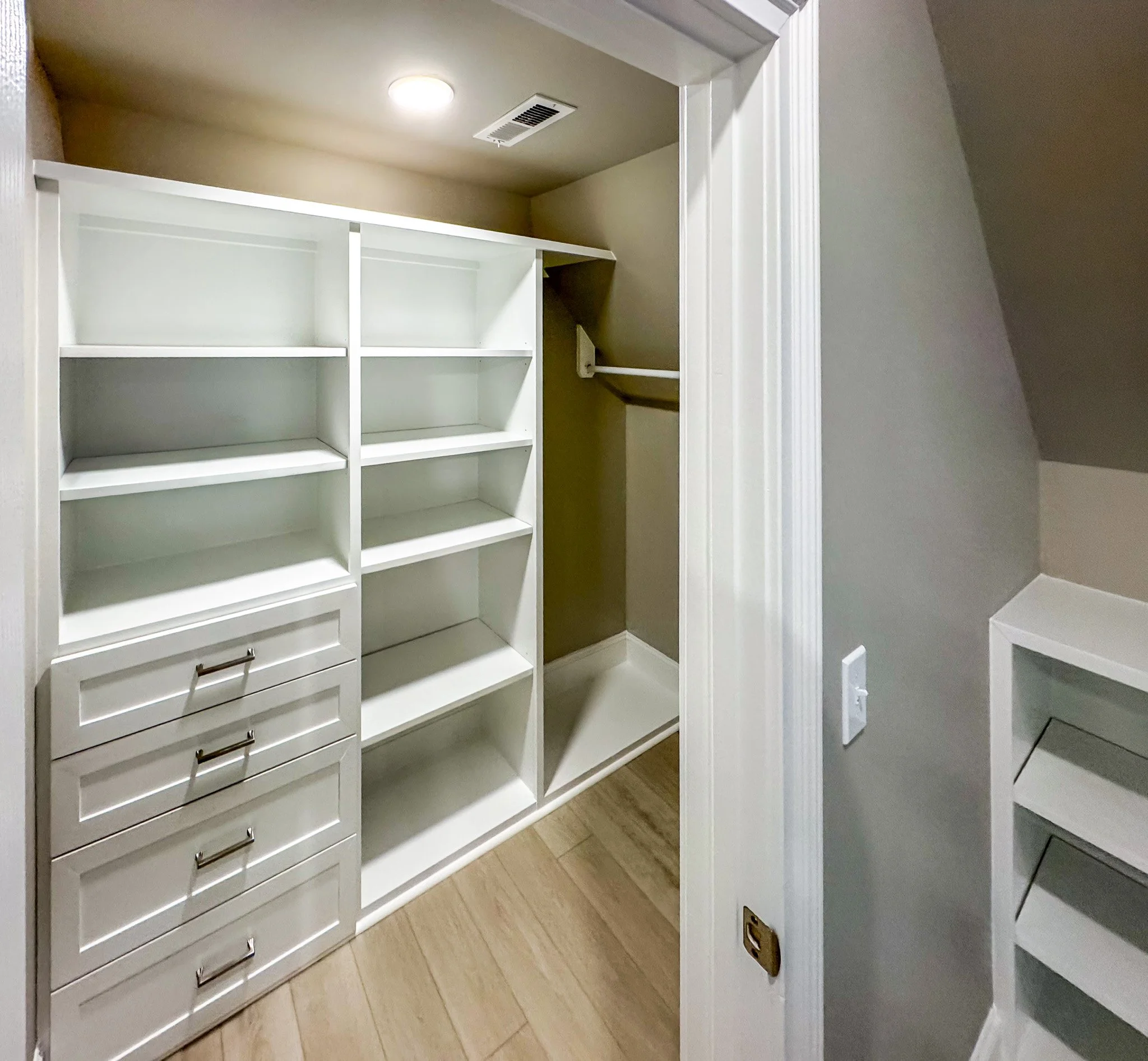 Finished attic build-out with custom built-ins, skylights, and open living space in Garner, NC, adding functional square footage and storage to the home.