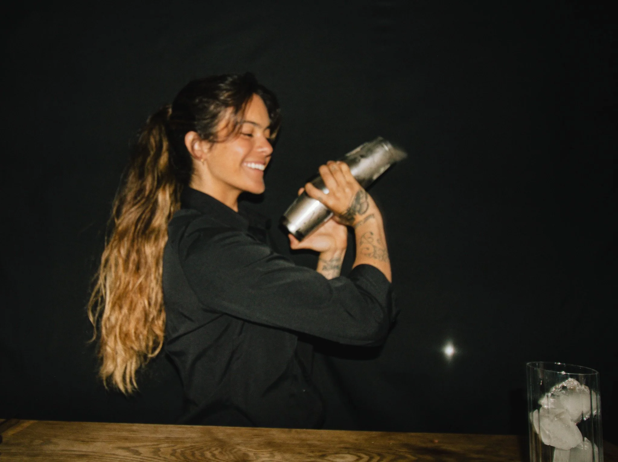 Wildfire Bartender, Paula, presenting a Gin and Tonic.