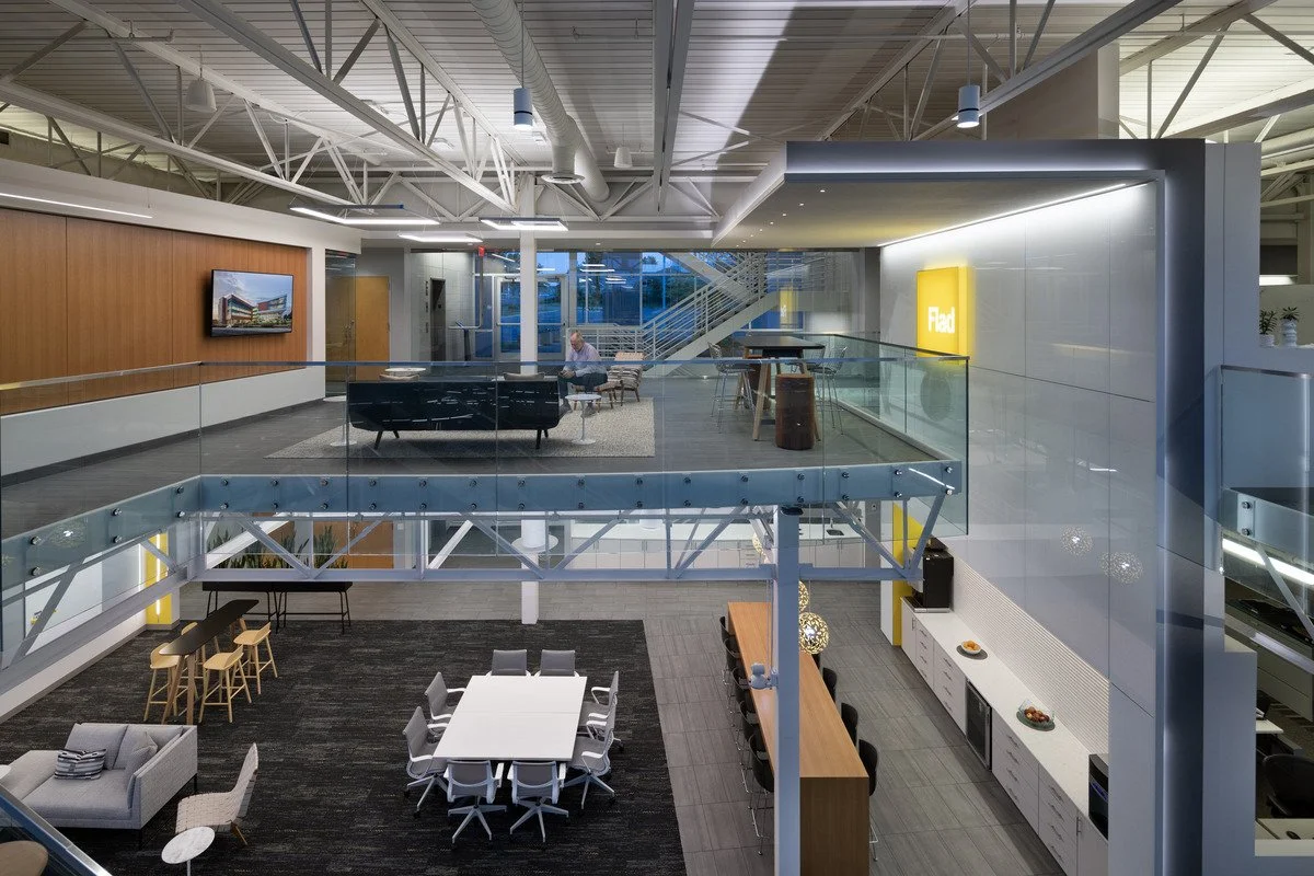 Pivotal remodeled Flad’s lobby, featuring architectural cove detailing, decorative interior pendant lighting, and uplighting. 