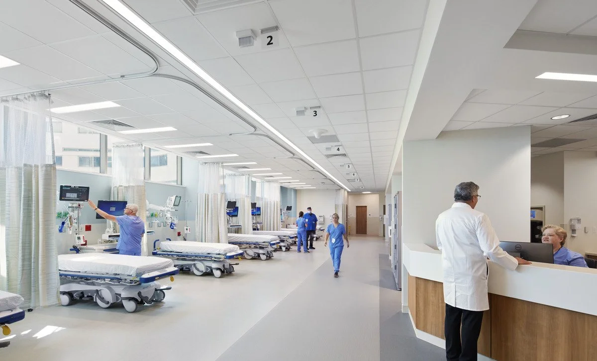 The exam room is equipped with ceiling-mounted downlights and task lighting.