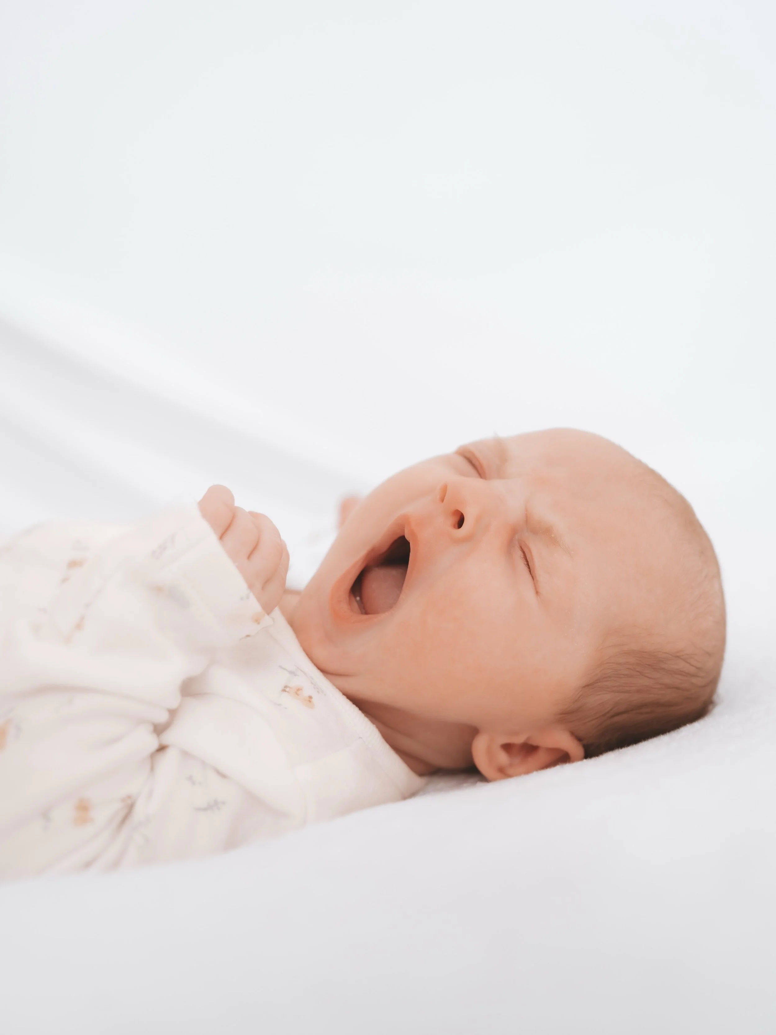 Oh, that tiny yawn 🥹🤍

The sleepy stretches, scrunched-up noses, tiny fingers and those little yawns you wish you could bottle up forever. ✨

Newborns change so incredibly quickly, which is why I love capturing all the beautiful little details exac