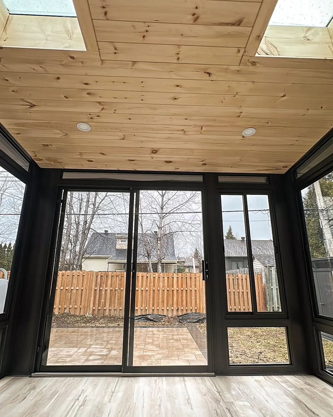 Black framing, pine finishes, glass doors, and skylights that pull natural light deep into the room.

Designed to feel open during the day and warm at night.

#SunspaceUbora #SunroomDesign #OutdoorLiving #PineCeiling #BlackFraming #ThreeSeasonRoom #I