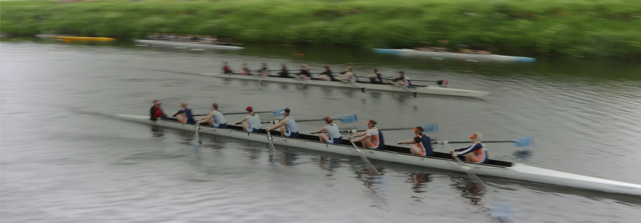 Synchronized rowing team gaining speed