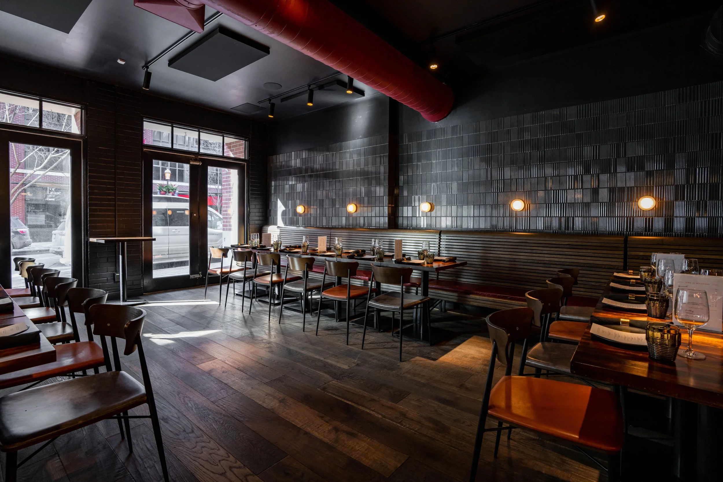 a private space in an italian restaurant well suited for a large gathering or group dinner.