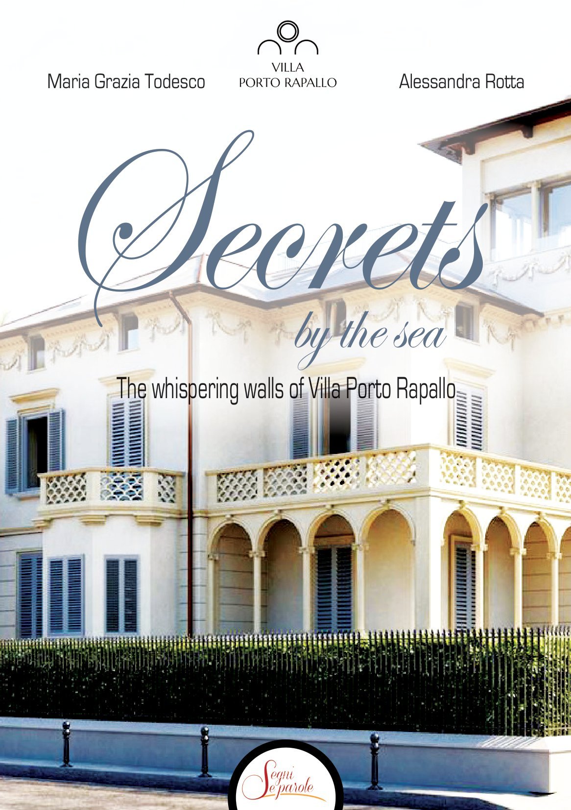 Book cover titled 'Secrets by the Sea: The whispering walls of Villa Porto Rapallo' featuring a photo of a white villa with blue shutters and a balcony, with decorative writing.