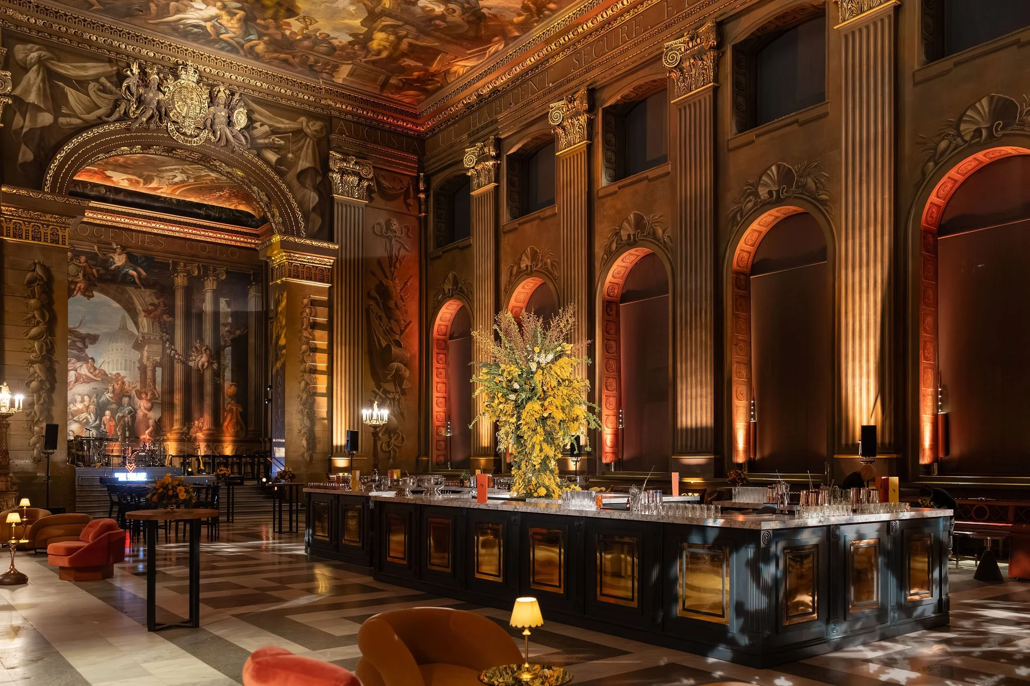 Painted Hall bar dressed with large-scale spring floral installations at the Old Royal Naval College