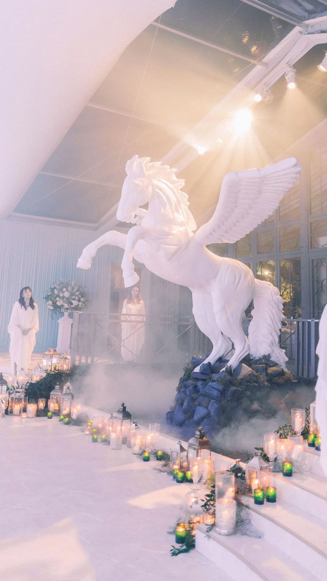 Finished Pegasus installation at Fantasia, elevated above the space and surrounded by candlelight. 