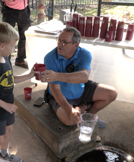 Record Heat, Crowds Mark Spring Water Festival