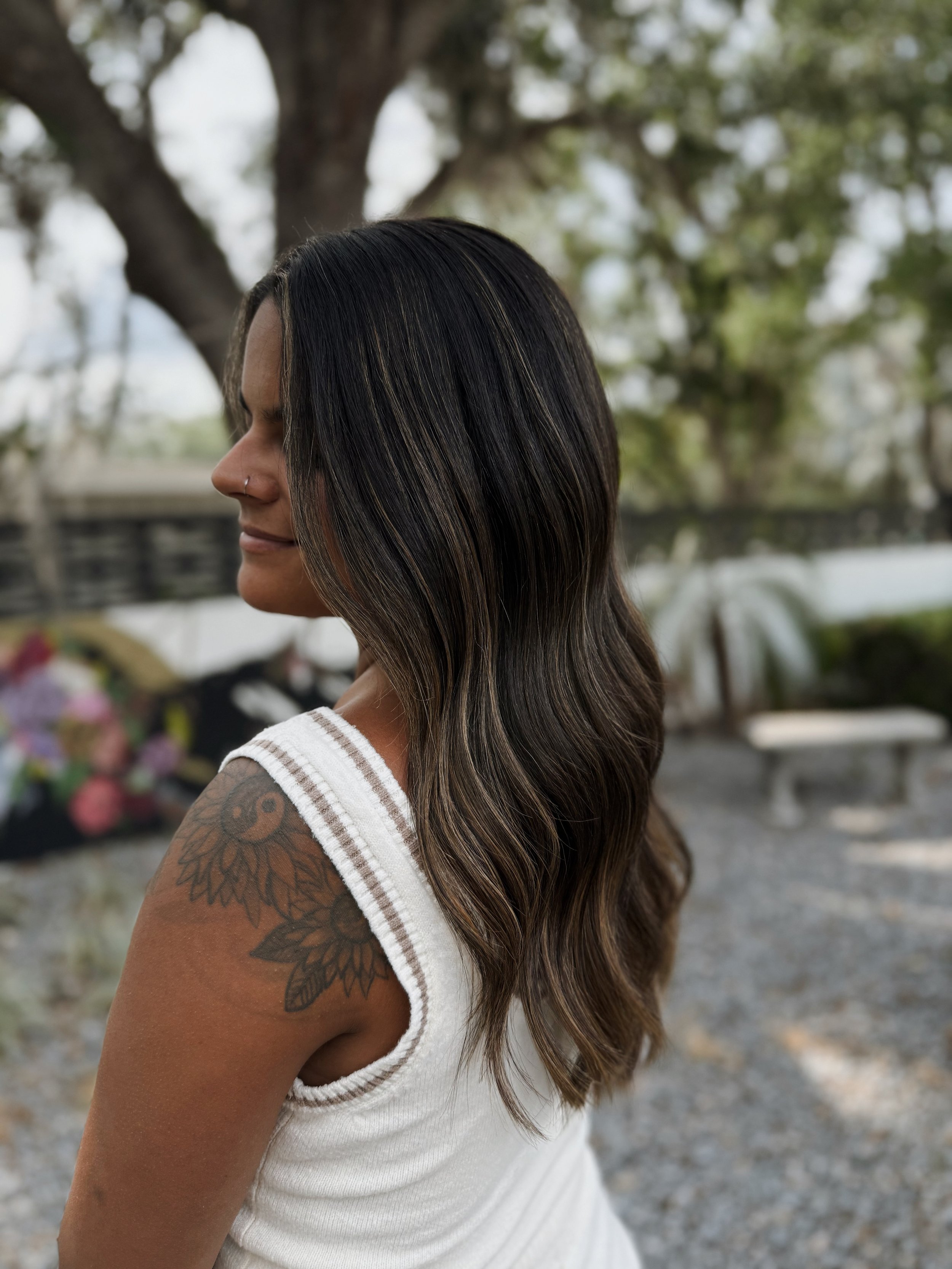 Luxury hairstylist in Brandon FL specializing in Invisible Bead Extensions, non-toxic color, dimensional brunettes, grey coverage, K-Tip extensions, and personalized, wellness-focused hair transformations for busy women seeking quiet luxury, holistic
