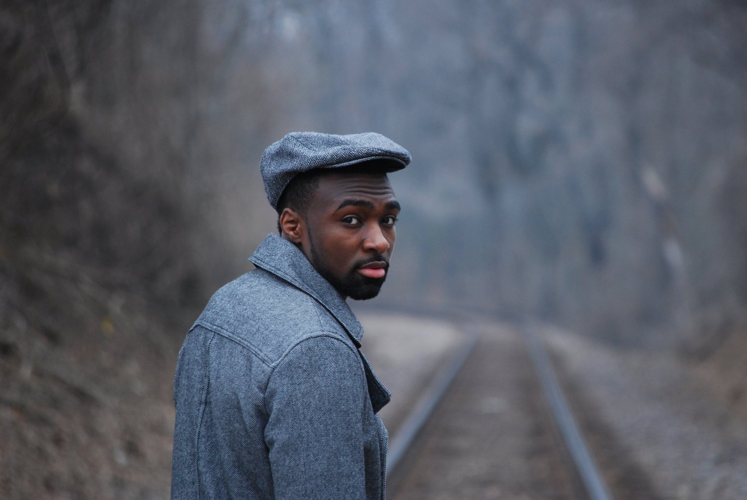 A man looking back during an outdoor creative portrait session