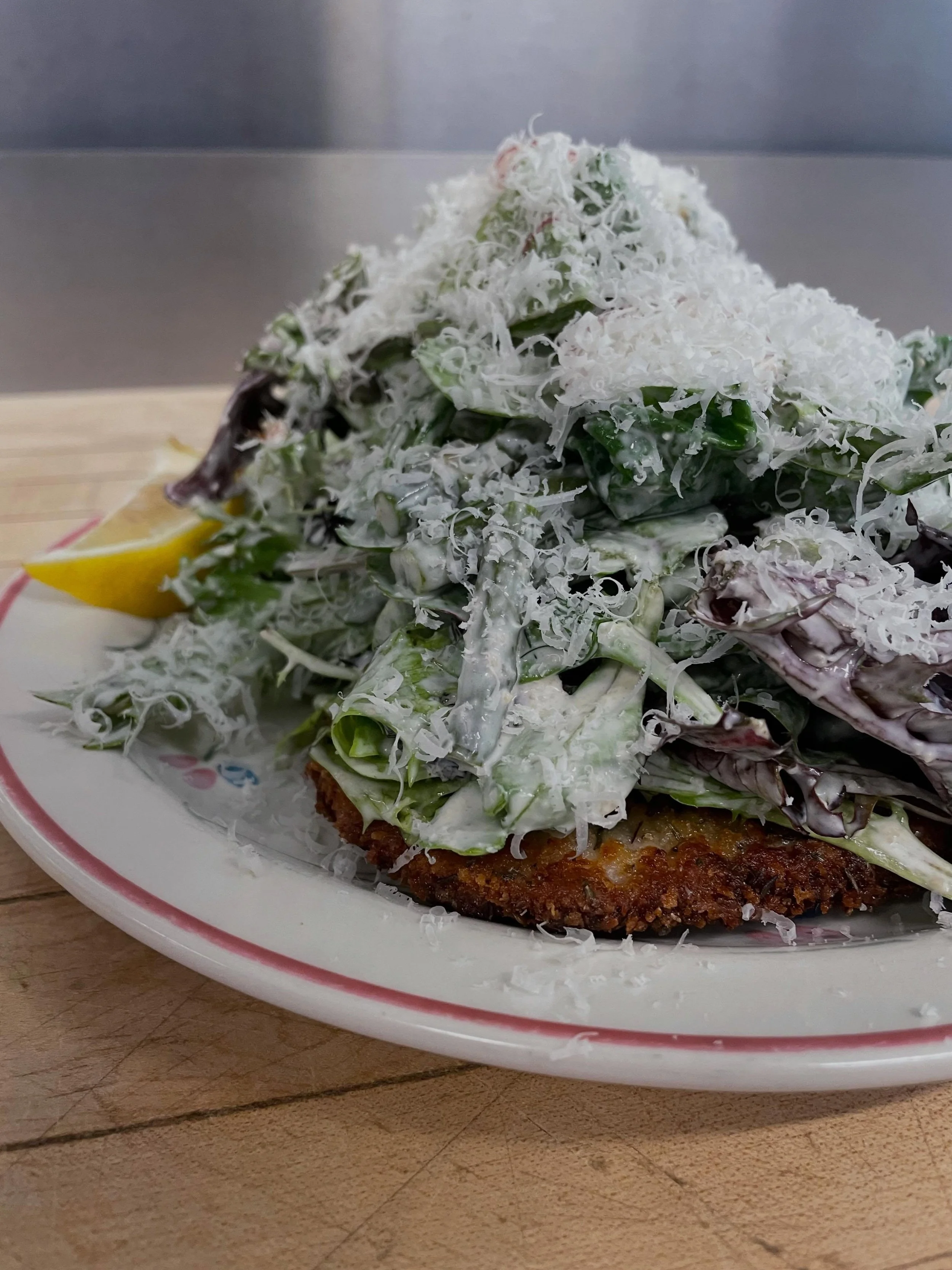 Find the bone in pork schnitzel under the mountain of ceasar salad&hellip;

#salad #princeedwardcounty #pec