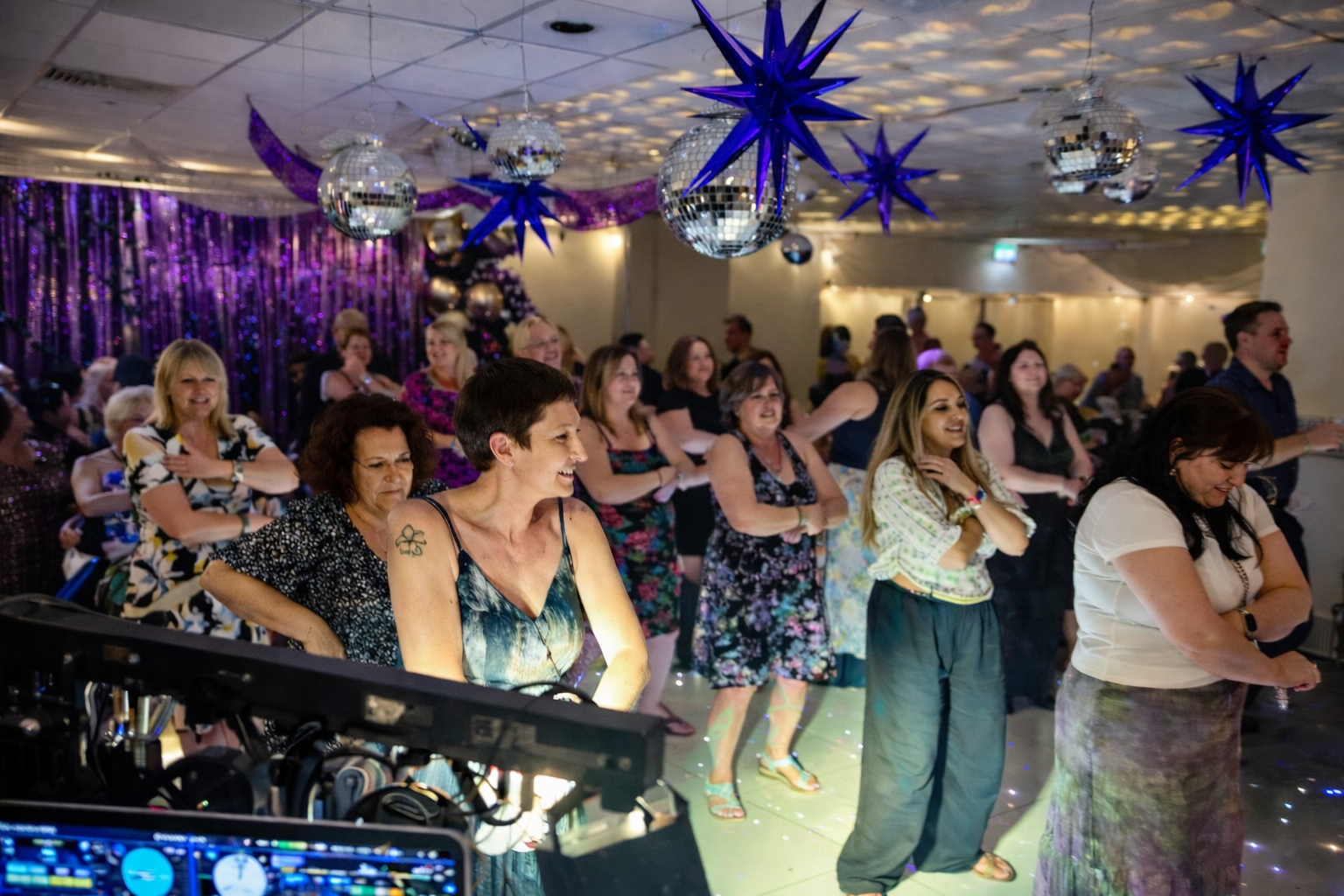 Professional DJ setup with lighting and sound at private event