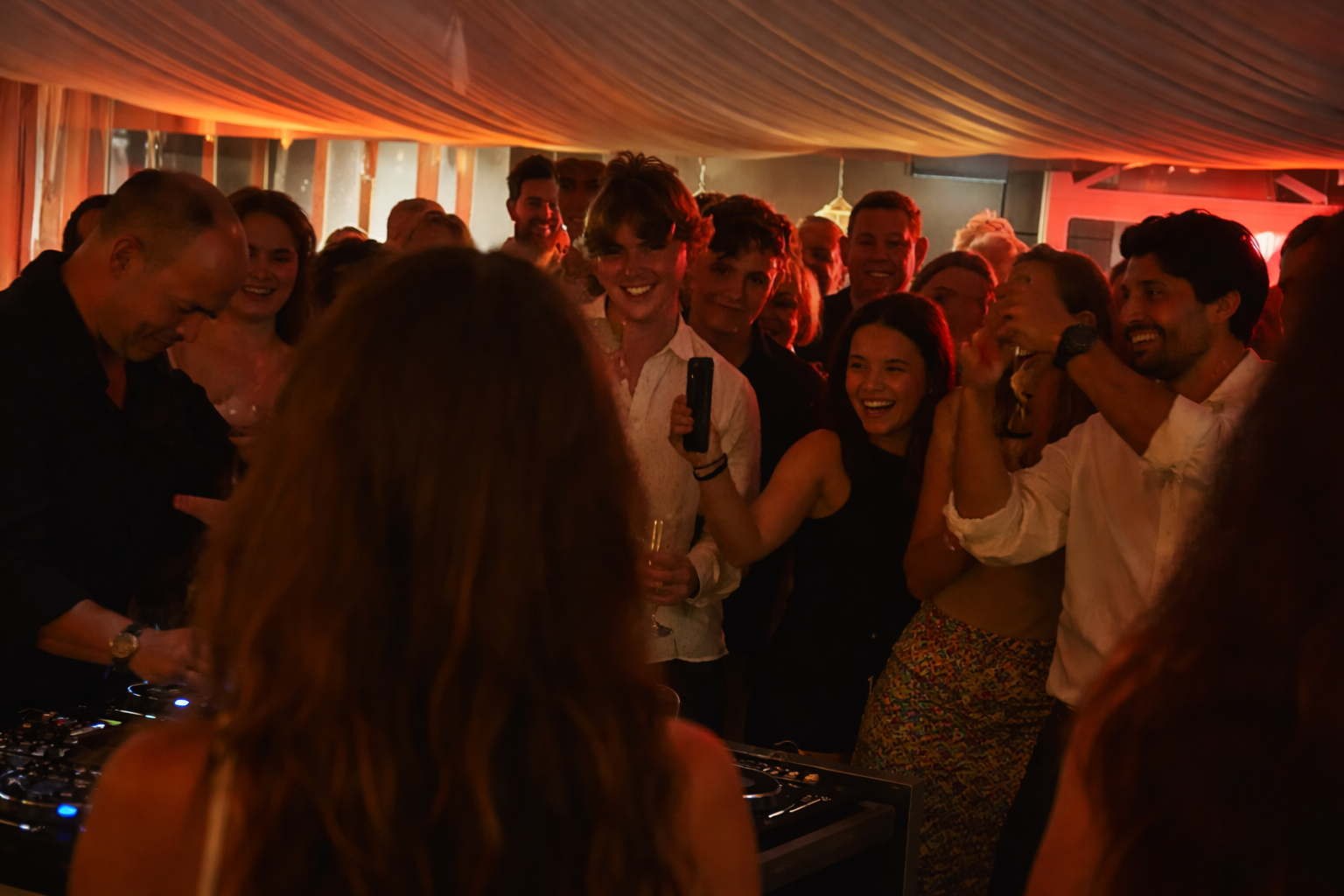 High-energy private party dancefloor with DJ lighting