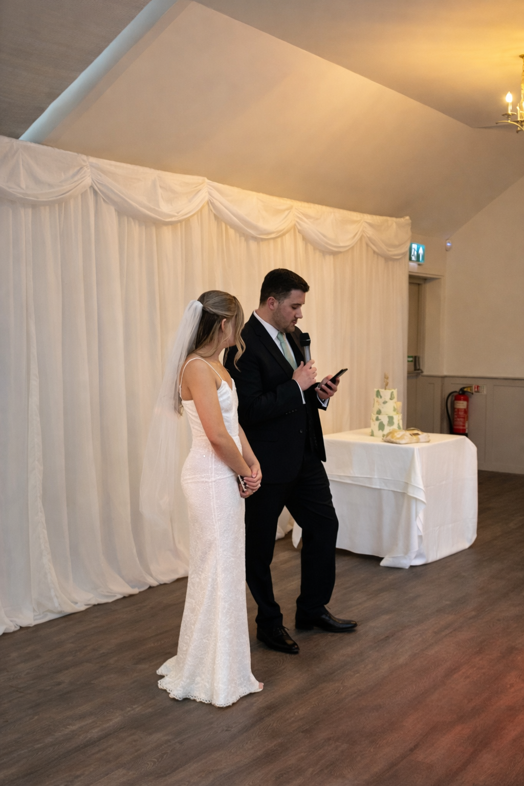 Wedding cake cutting with DJ providing background music