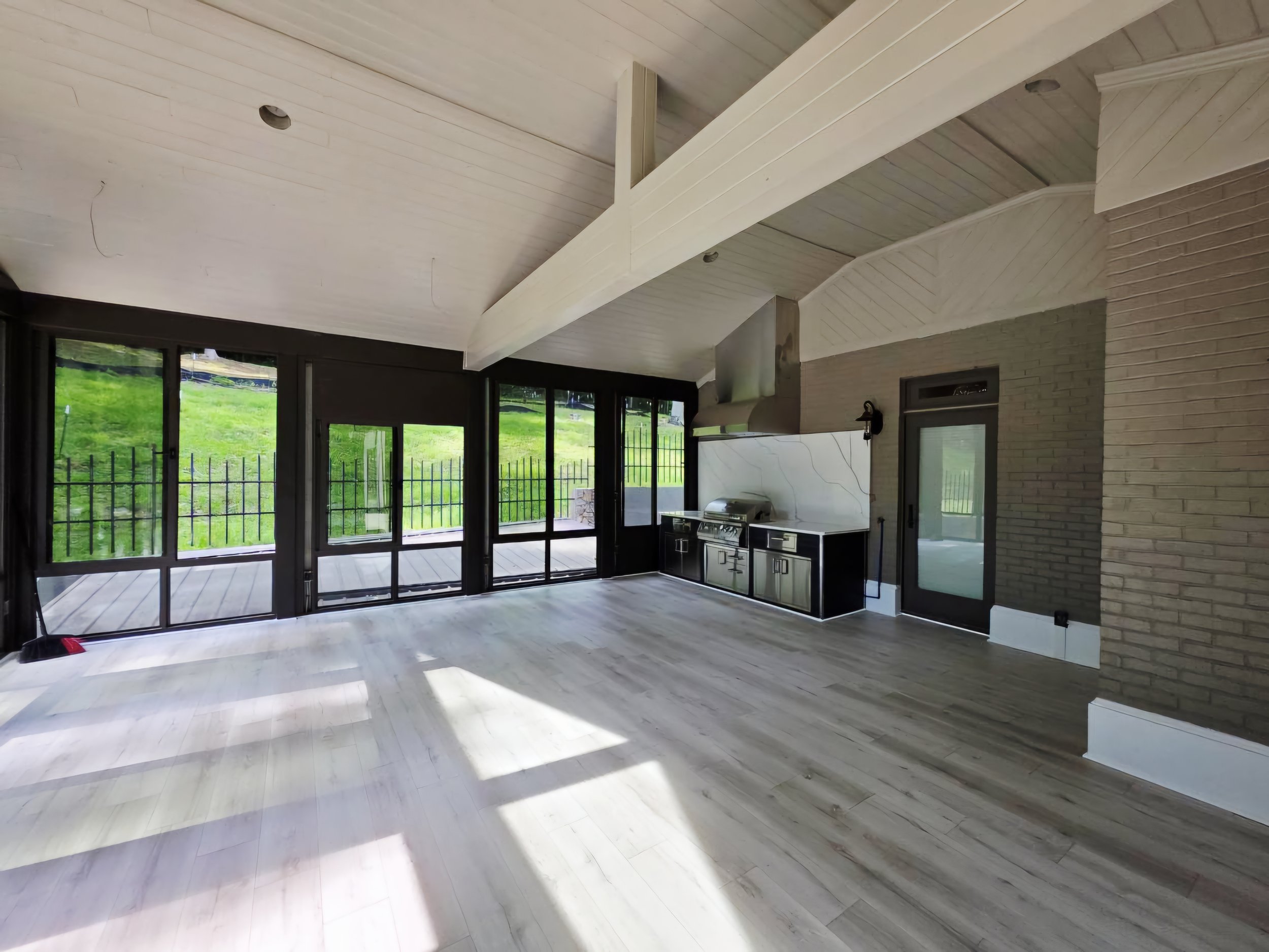 Built in grill and outdoor kitchen space designed in Waxhaw NC