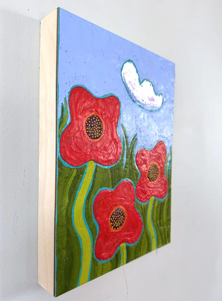 This encaustic poppy painting by Maine Artist Marcia Crumley feature three bright red poppies in summer.
