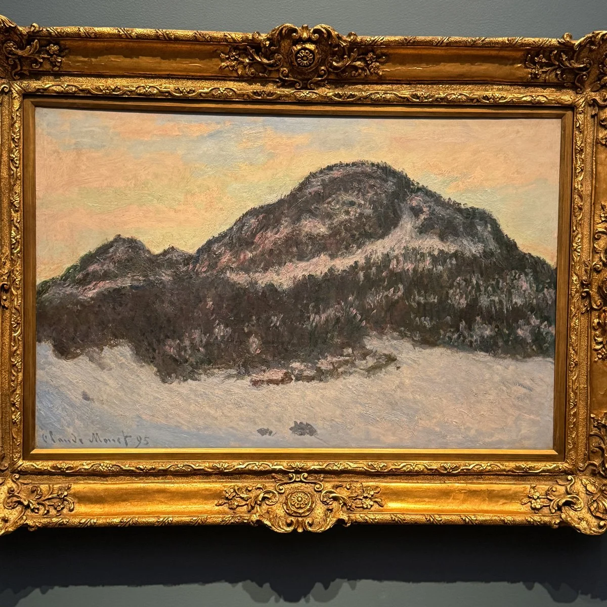 Monet painting of Mount Kolsås in Norway, with a soft pastel sky reflecting in the snow. This is one of nearly two dozen snow paintings Monet created in Norway in the winter of 1895.