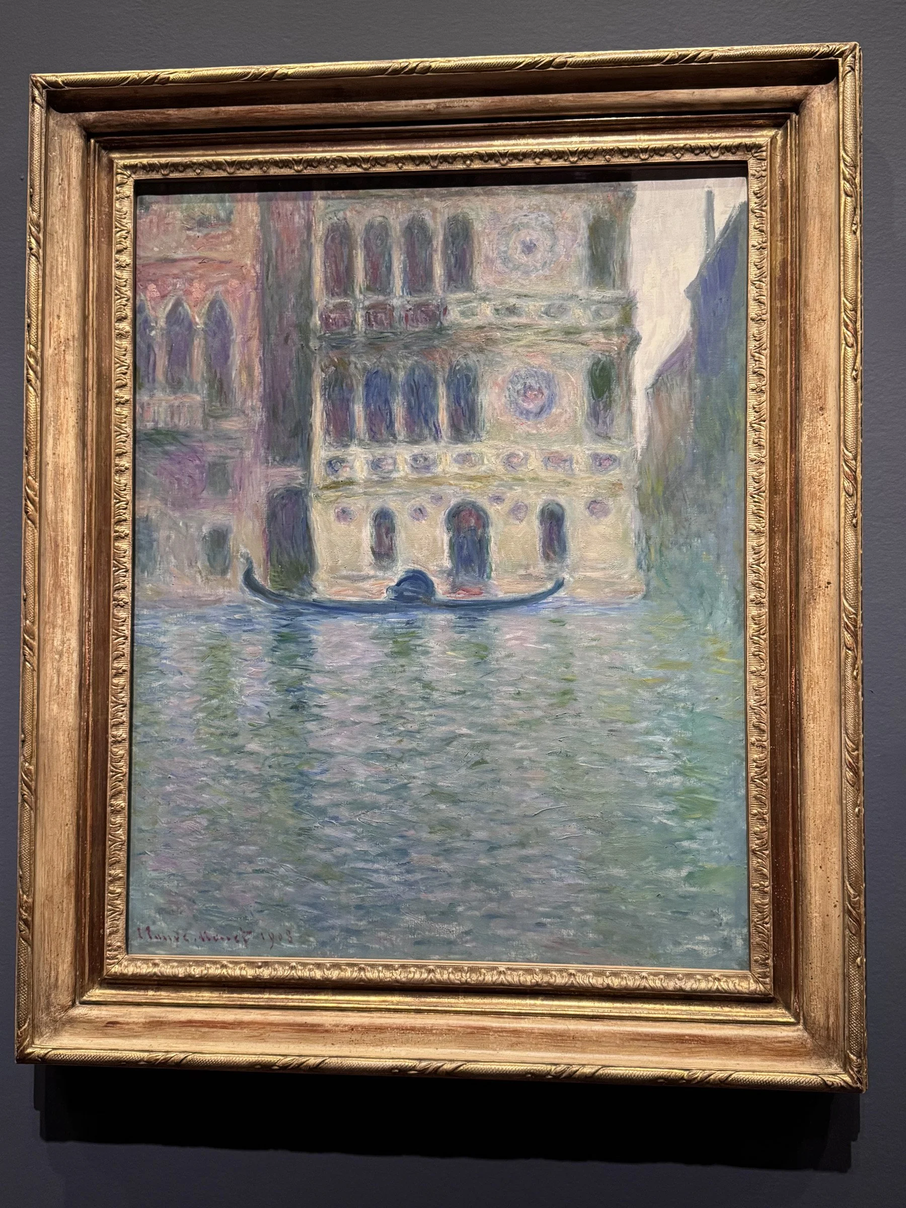 Monet's painting of the Palazzo Dario, a 15th Century palace noted for its circular stone medallions on the front. Monet uses the soft, diffused light to soften the architectural details.