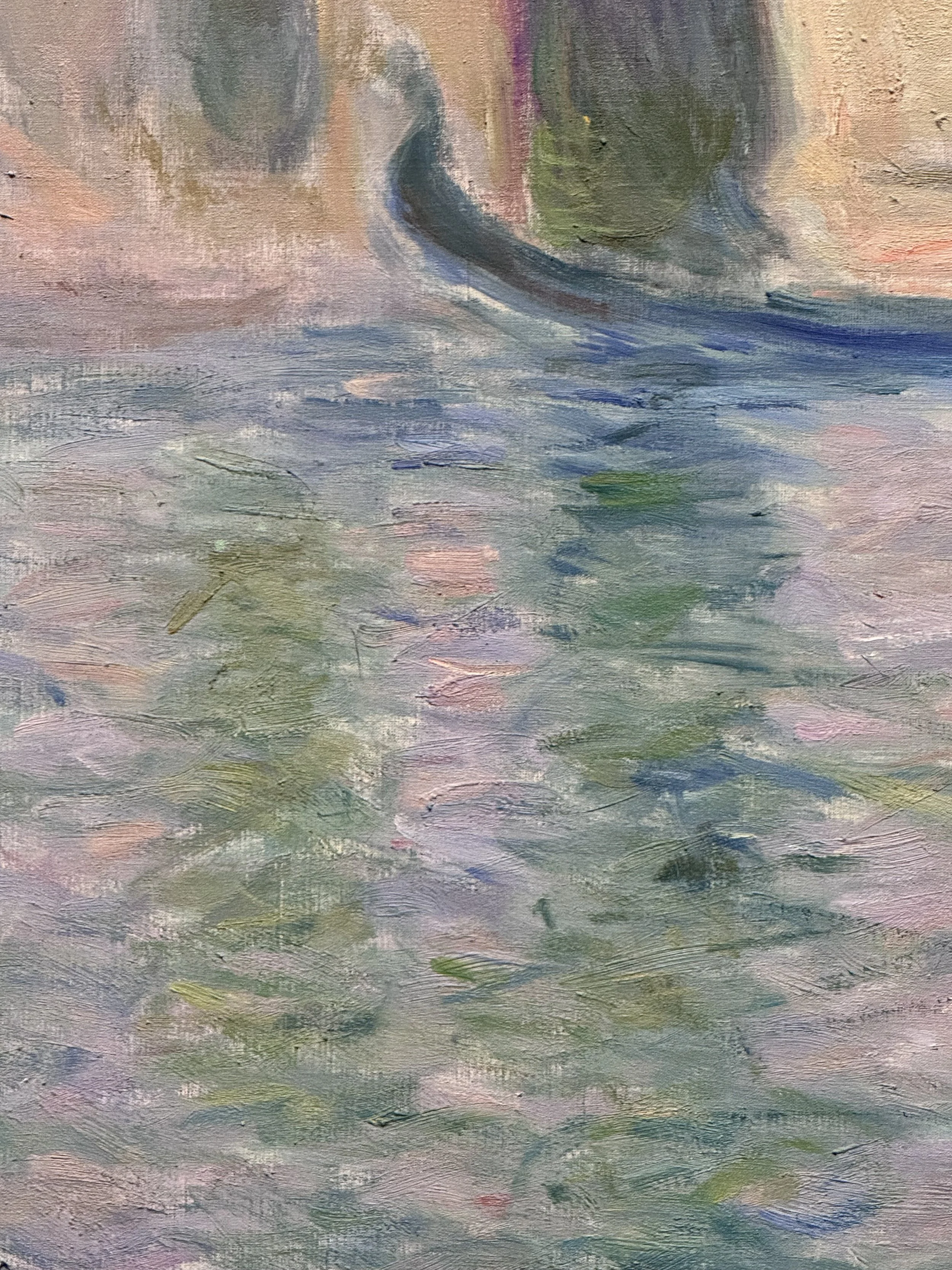 A closeup of a Monet palazzo painting, showing how loose and painterly the brush strokes are that render the palazzo, the gondola, and the canal.