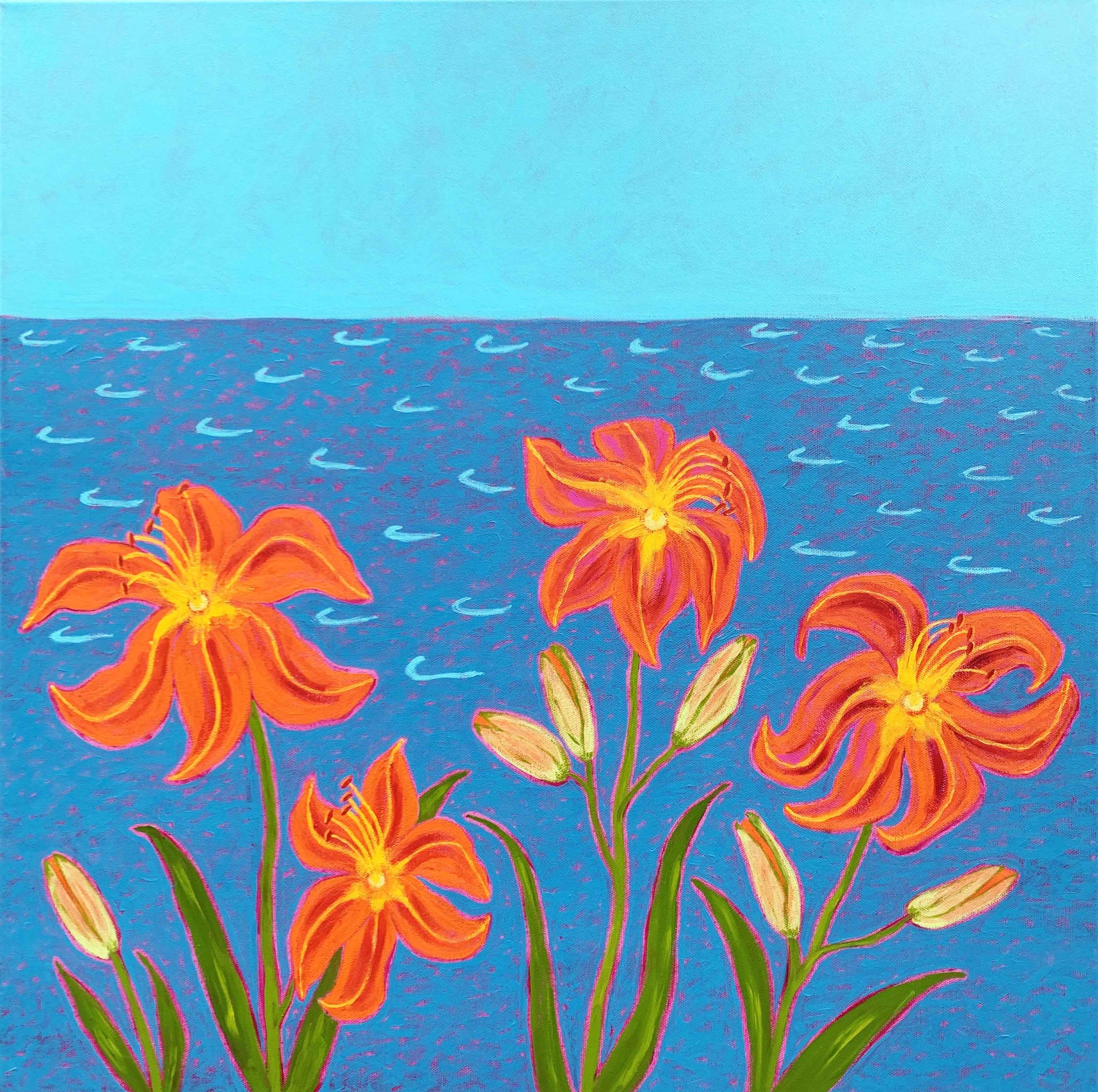Bright orange day lilies by the side of a brilliant blue lake.lake