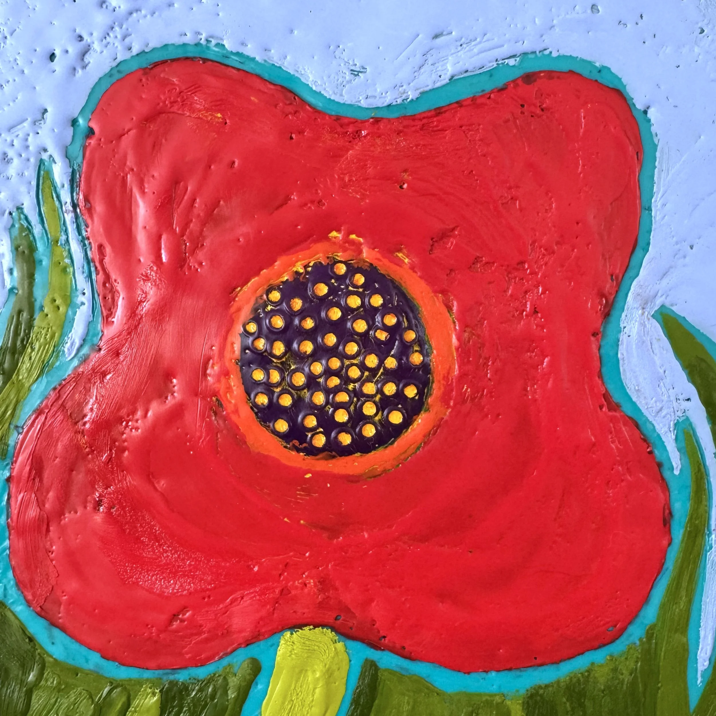 Red poppy art full of color and texture, with carved poppy heads.